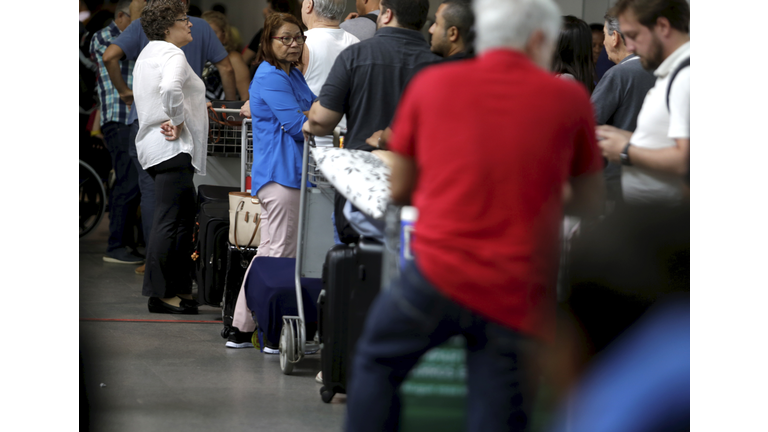 passengers in airport boarding area