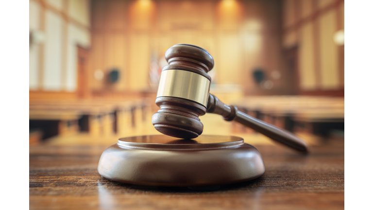 Judges gavel in courtroom legal trial and law background