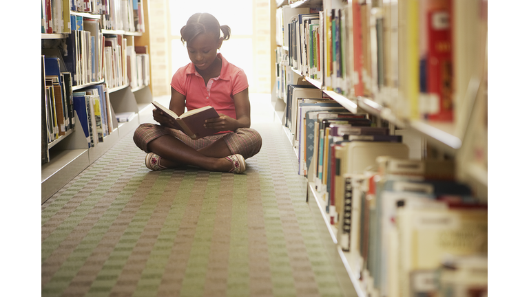Girl reading at the library