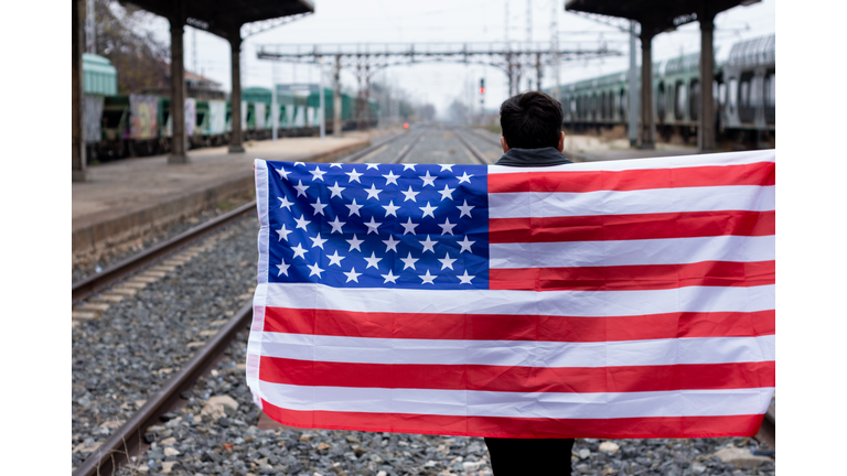 Rocker with sunglasses displaying the usa flag