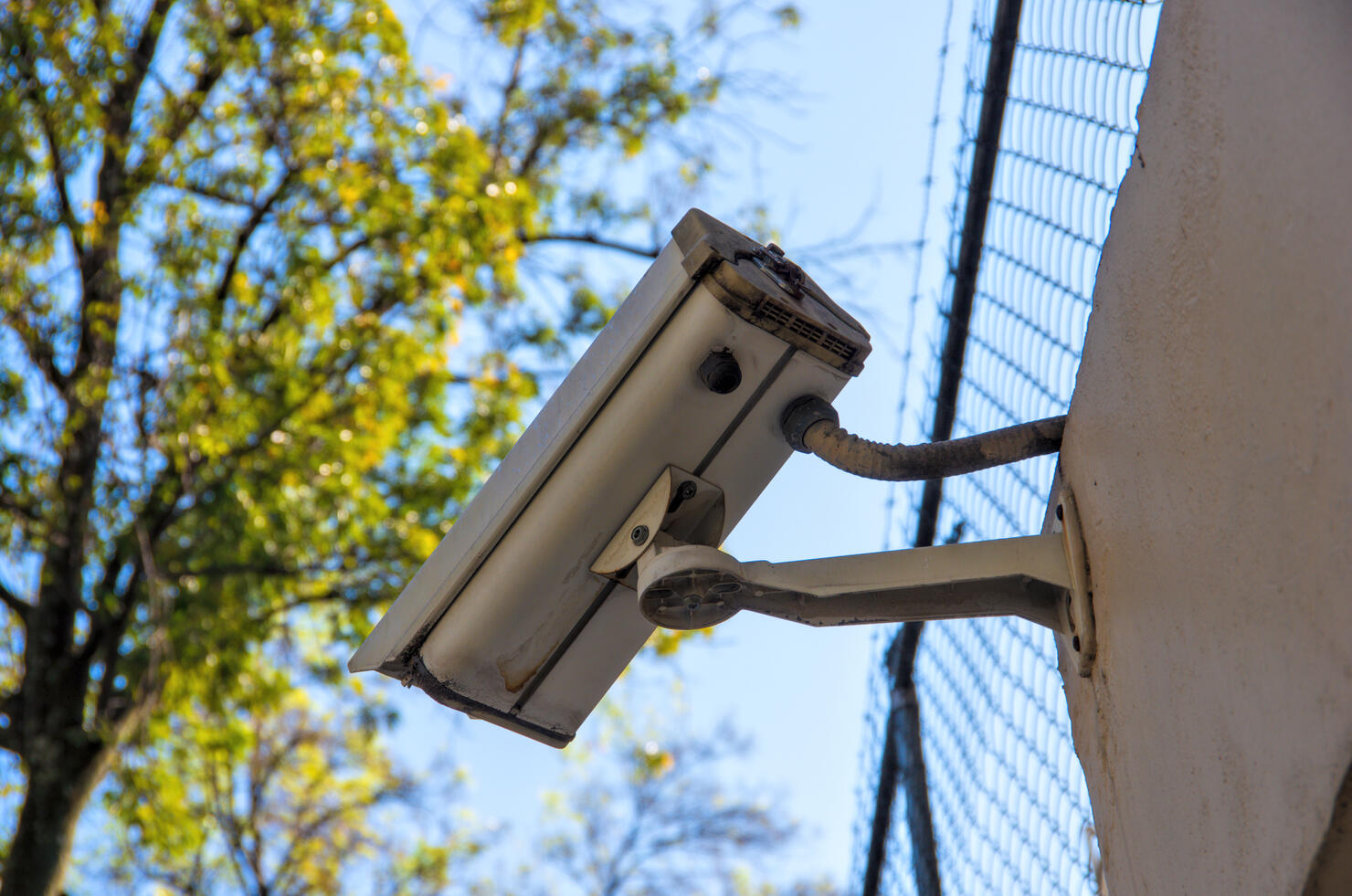Security camera on the surrounding wall