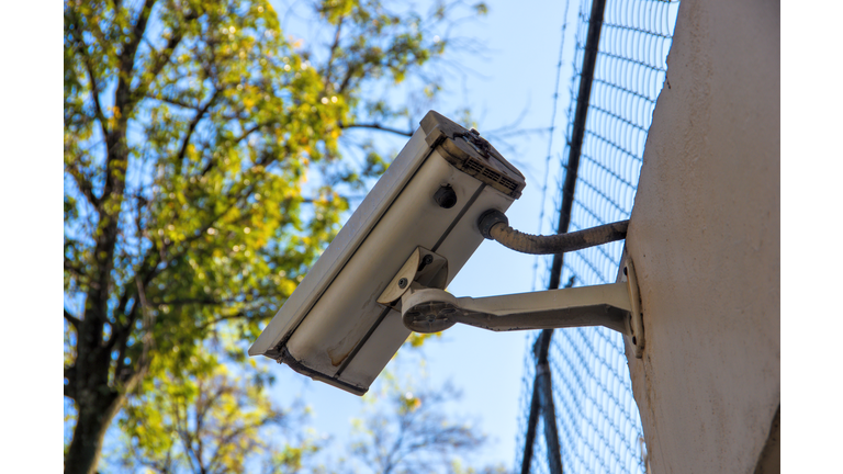 Security camera on the surrounding wall