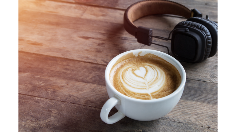 latte coffee cup and headphone on table