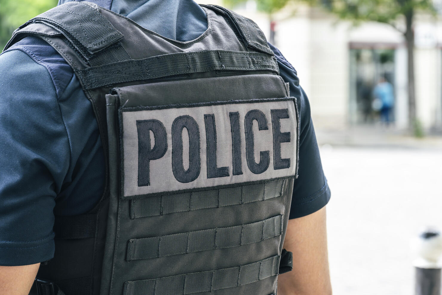 “Police” written on the back of a French police uniform (France)