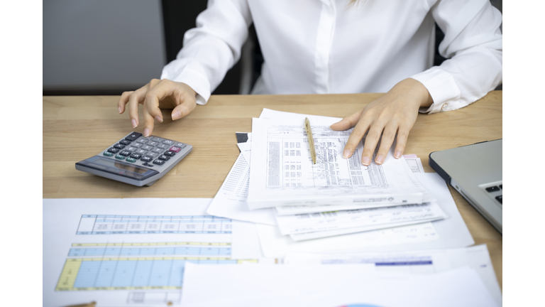 Accountant or banker calculate the cash bill.