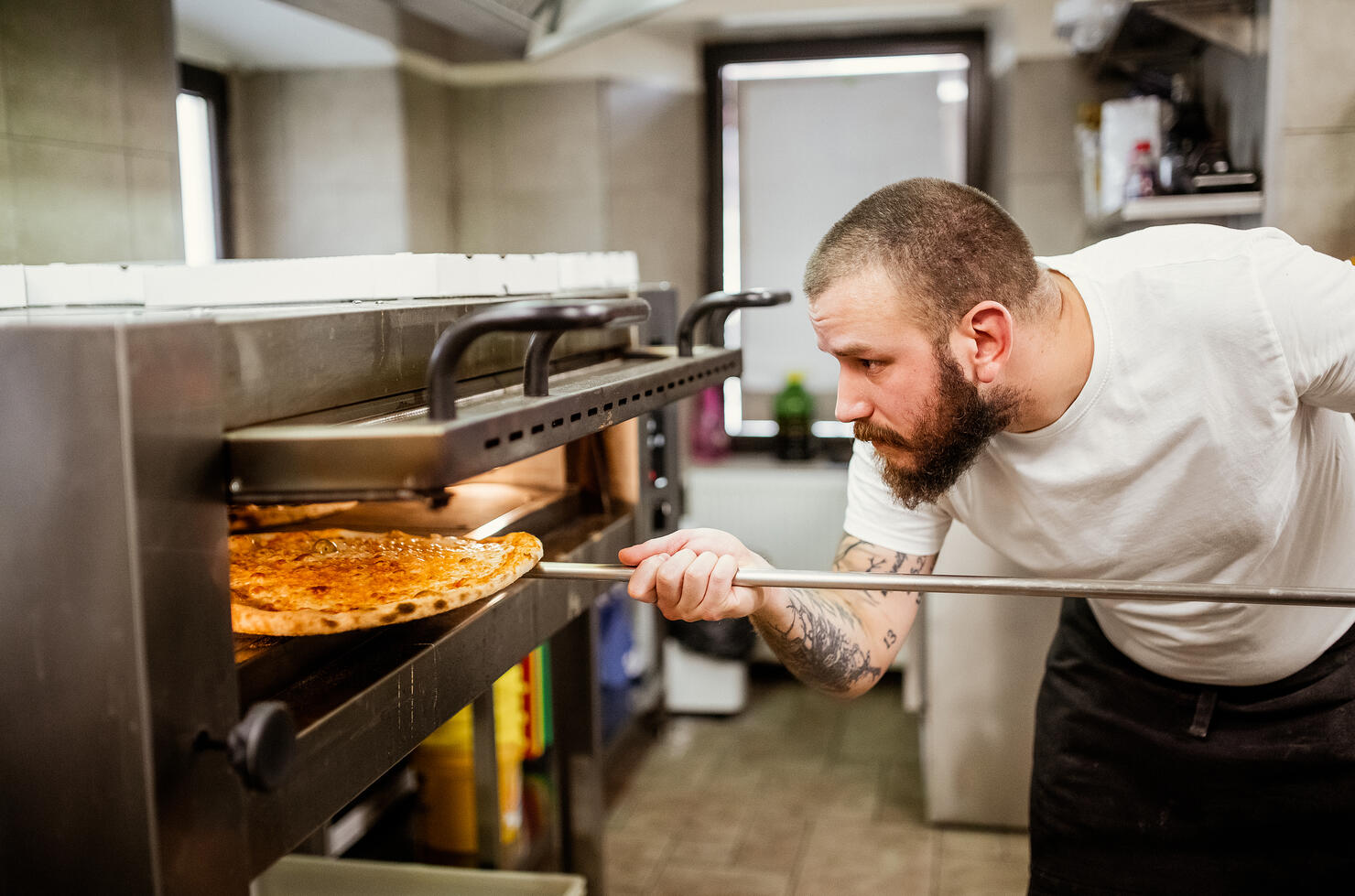 Pizza chef working in the kitchen
