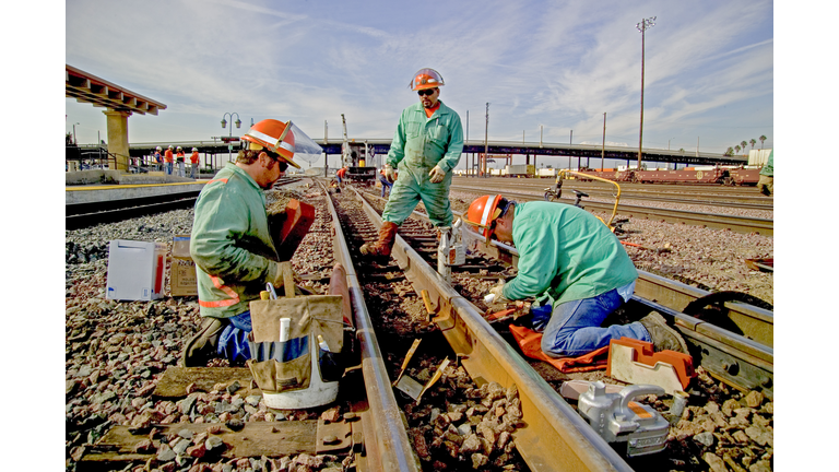 Railroad Crew Installs New Rail