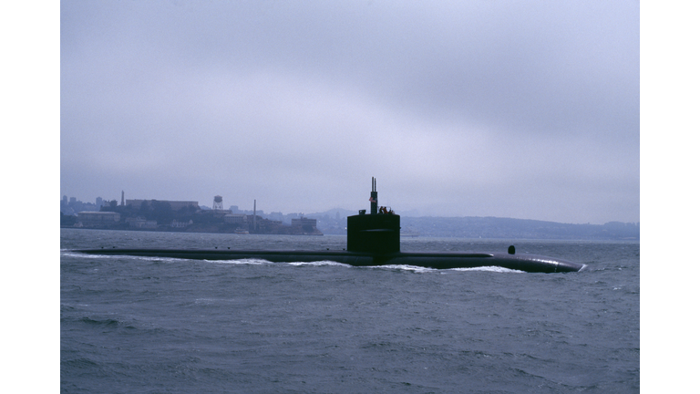 submarine slipping out to sea under fog San Francisco Bay