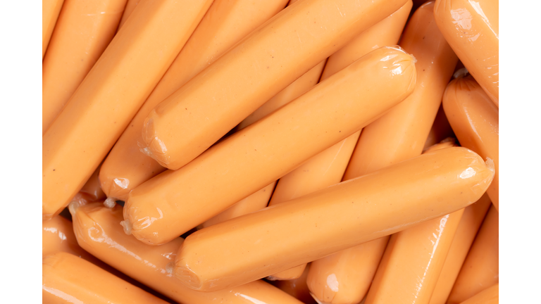 Heap of chicken vienna sausage wrapped in plastic. Close up