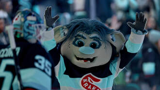 Seattle Kraken mascot gets chased by a grizzly bear