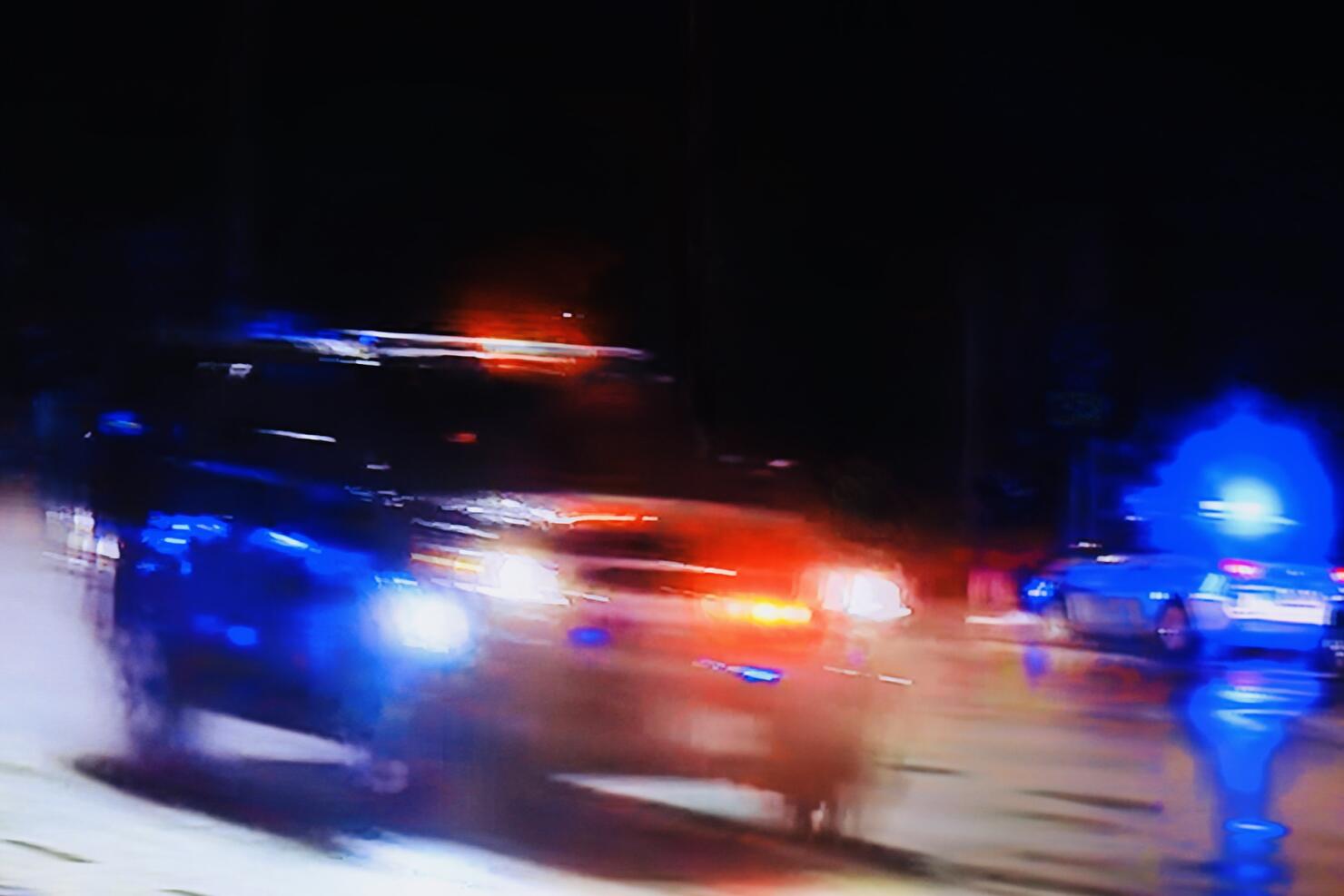 Flashing lights from a high speed police chase