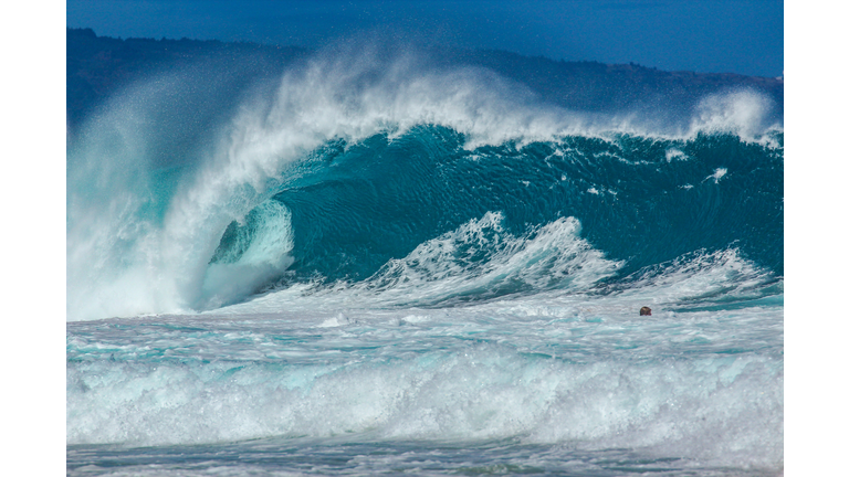 Powerful blue wave barrelling