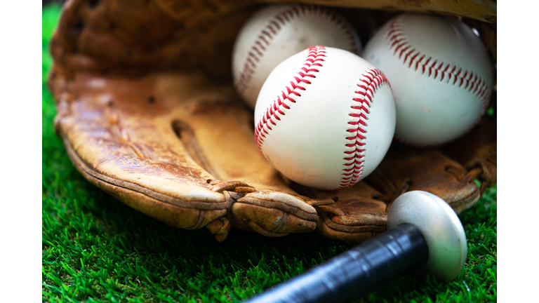 A close up image  of  baseball,baseball glove,baseball bat