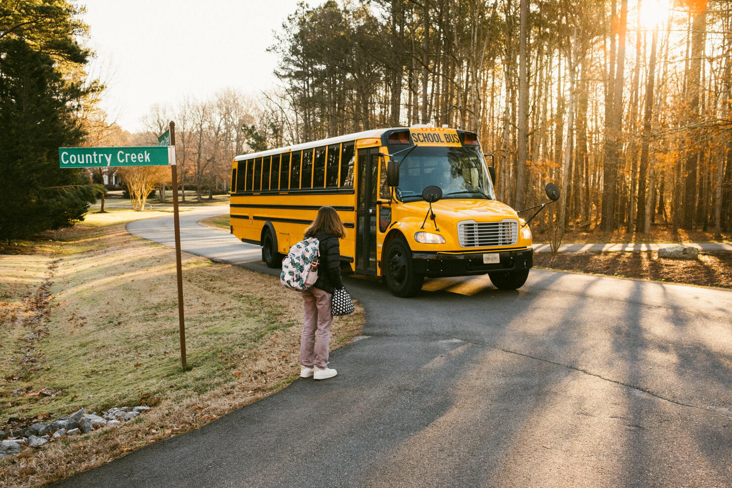 Junior High Student wait at School Bus Stop