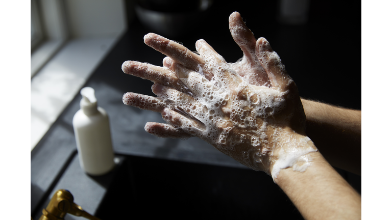 Young man washing hands