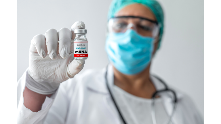 Doctor holding mRNA vaccine