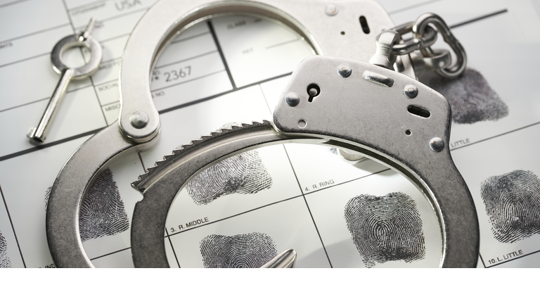 Handcuffs on fingerprint document from getting arrested