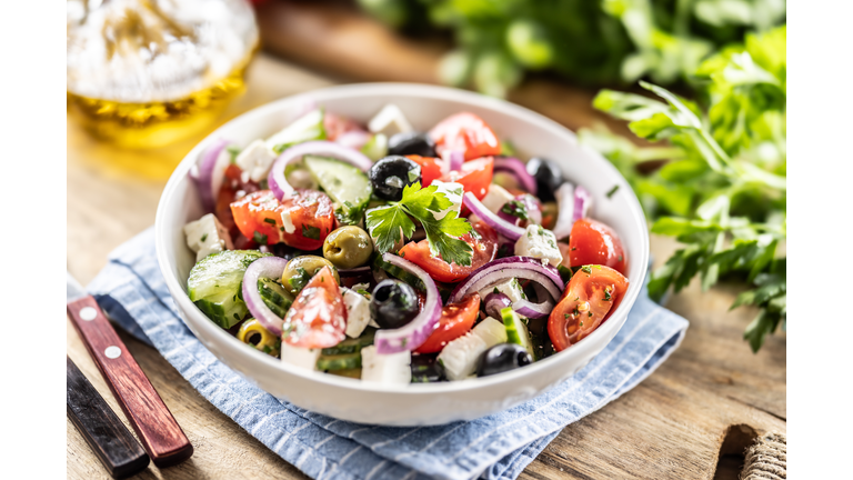 A healthy Mediterranean salad of Greek origin consisting of tomatoes, cucumbers, olives and Feta cheese, seasoned with parsley and olive oil.