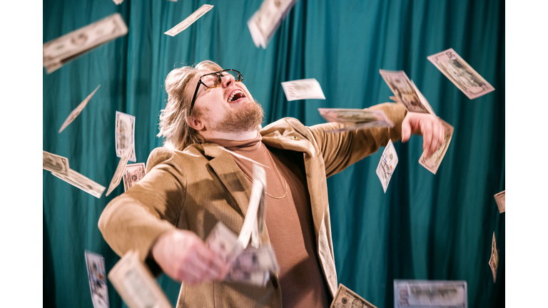 Retro Styled Man Celebrates in Falling Money