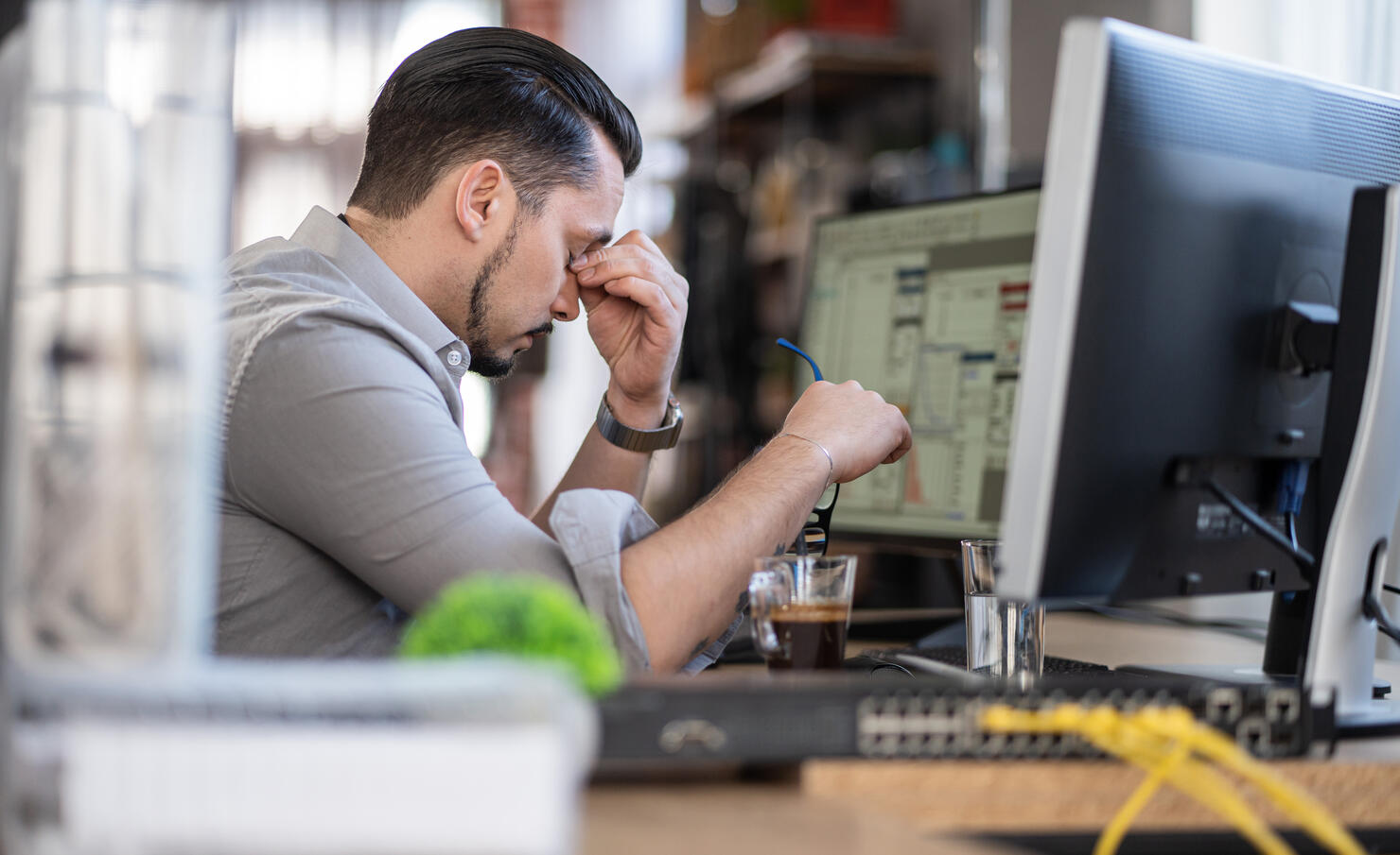 Emotion at work.Stressed out man working in a demanding career