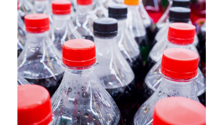 Carbonated soft drink bottles close up
