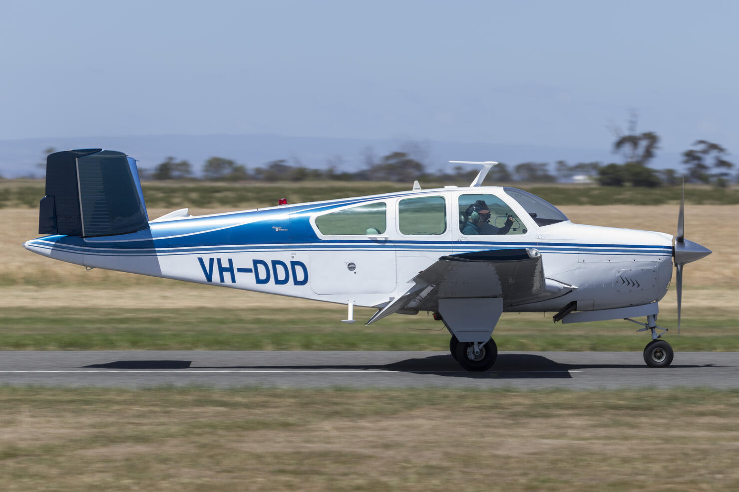 Beech V35 Bonanza light aircraft landing at Lethbridge airfield.