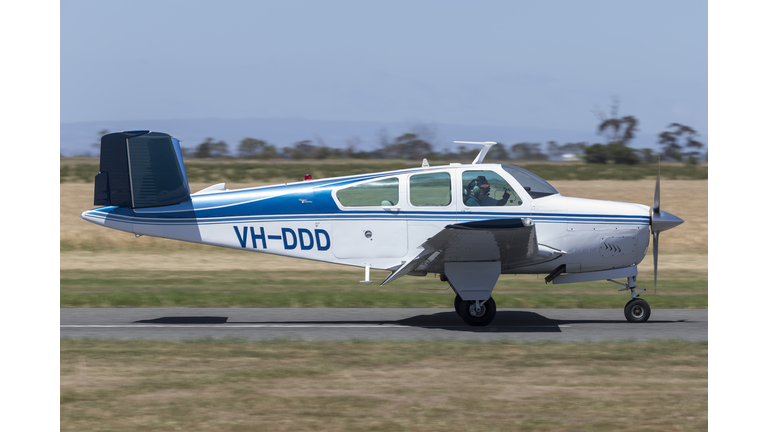 Beech V35 Bonanza light aircraft landing at Lethbridge airfield.