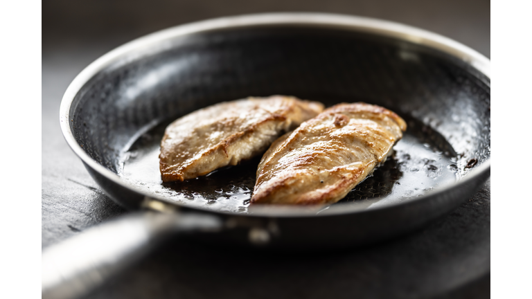 Chicken breast baked in olive or vegetable oil in a non-stick steel pan