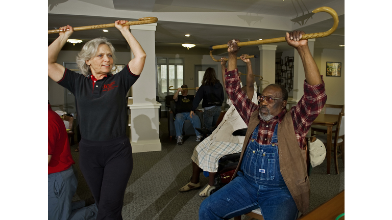 Senior instructor Karen Hubbard (L) warm