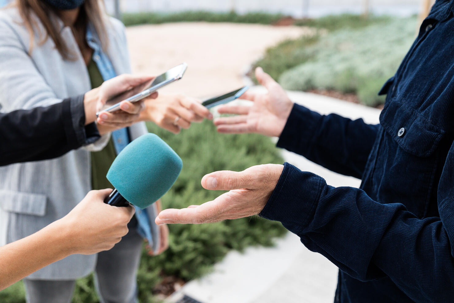 Close-up of an interview with smartphones and microphone - stock photo