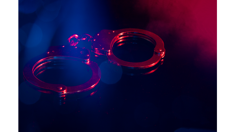 Handscuffs at Night with Red and Blue Light