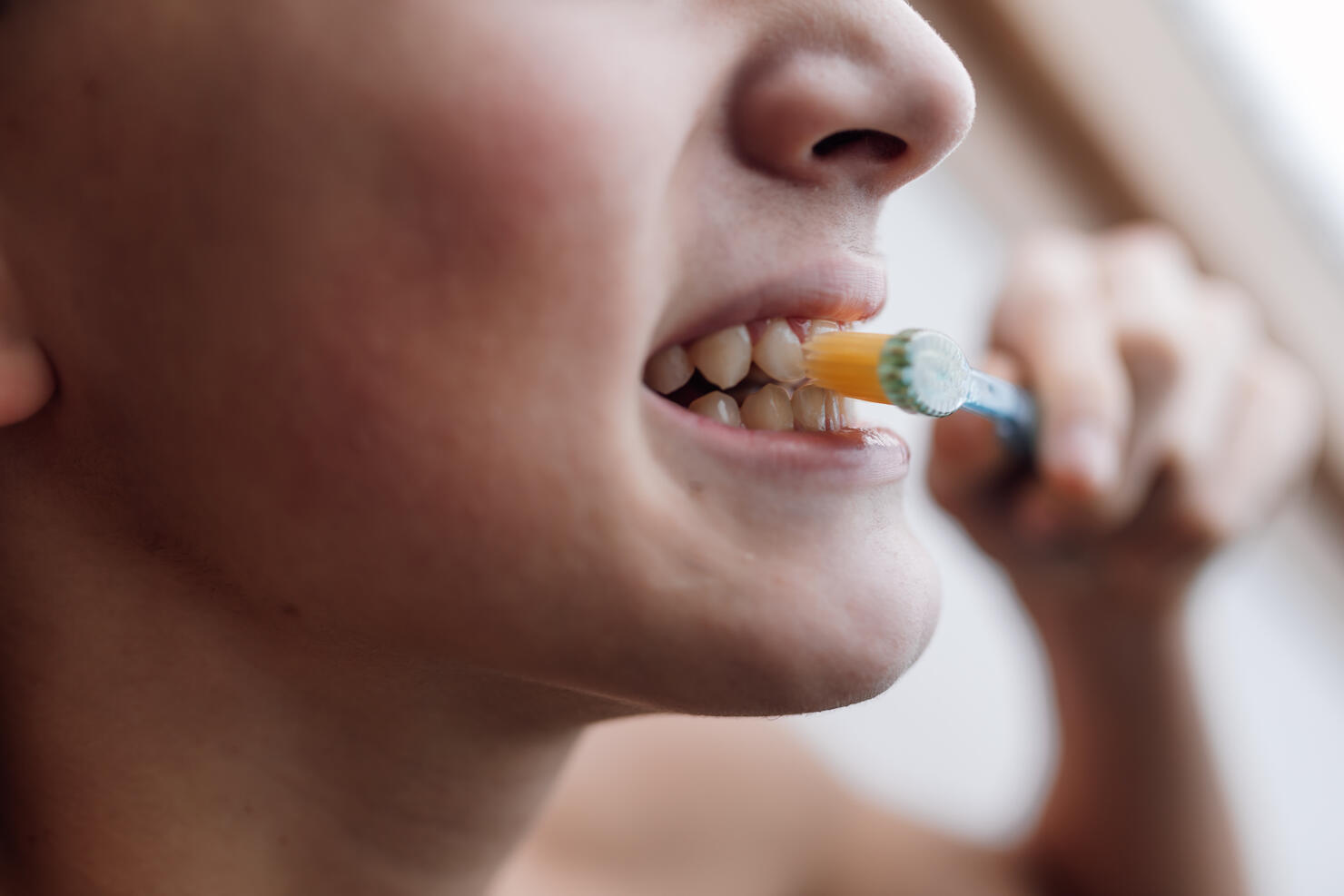 Brushing teeth for a healthy, clean smile.