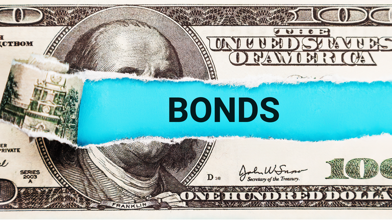 Bonds. The word Bonds in the background of the US dollar. Fixed Income Investment, Government Bonds, and Financial Security Concept.