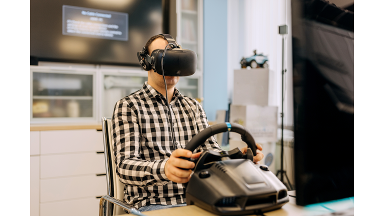 Male university student testing video game at computer lab