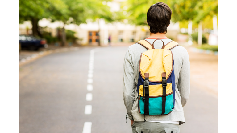 Student With Backpack Walking On Street