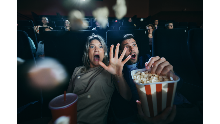 Watching a horror movie in cinema!