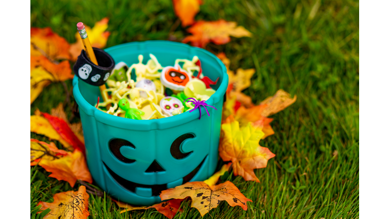 Halloween teal basket full of non-food treats