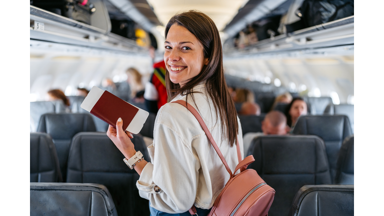 Young Woman Boarding An Airplane