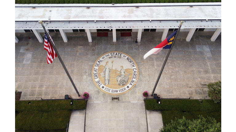 Aerial view of the North Carolina State legislature building with the state seal at the entrance