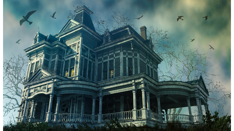 A haunting old Victorian house from a low angle