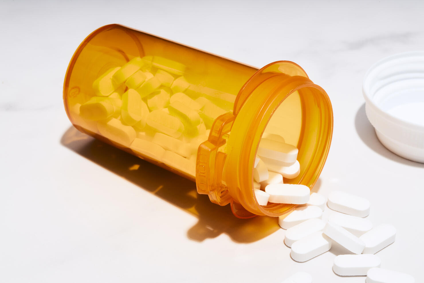 Pills spilled from a prescription bottle