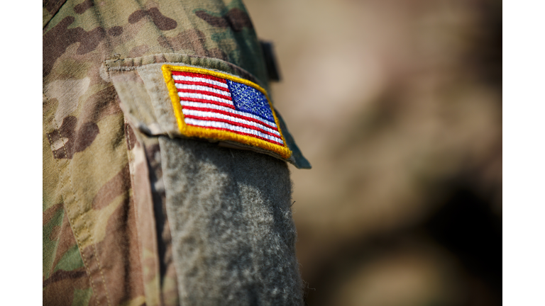 USA flag and US Army patch on solder's uniform