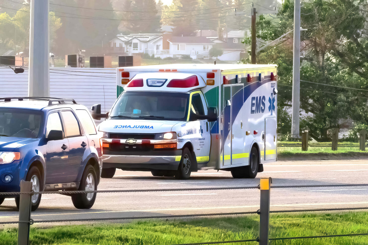 An EMS ambulance on the route during summer time.