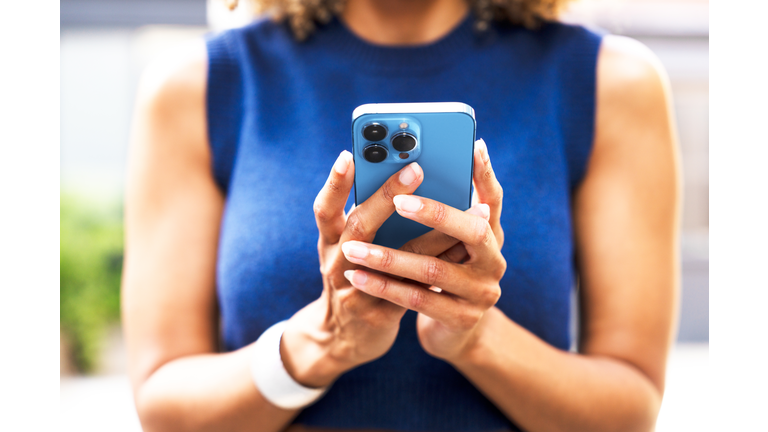 Close up of woman using smart phone