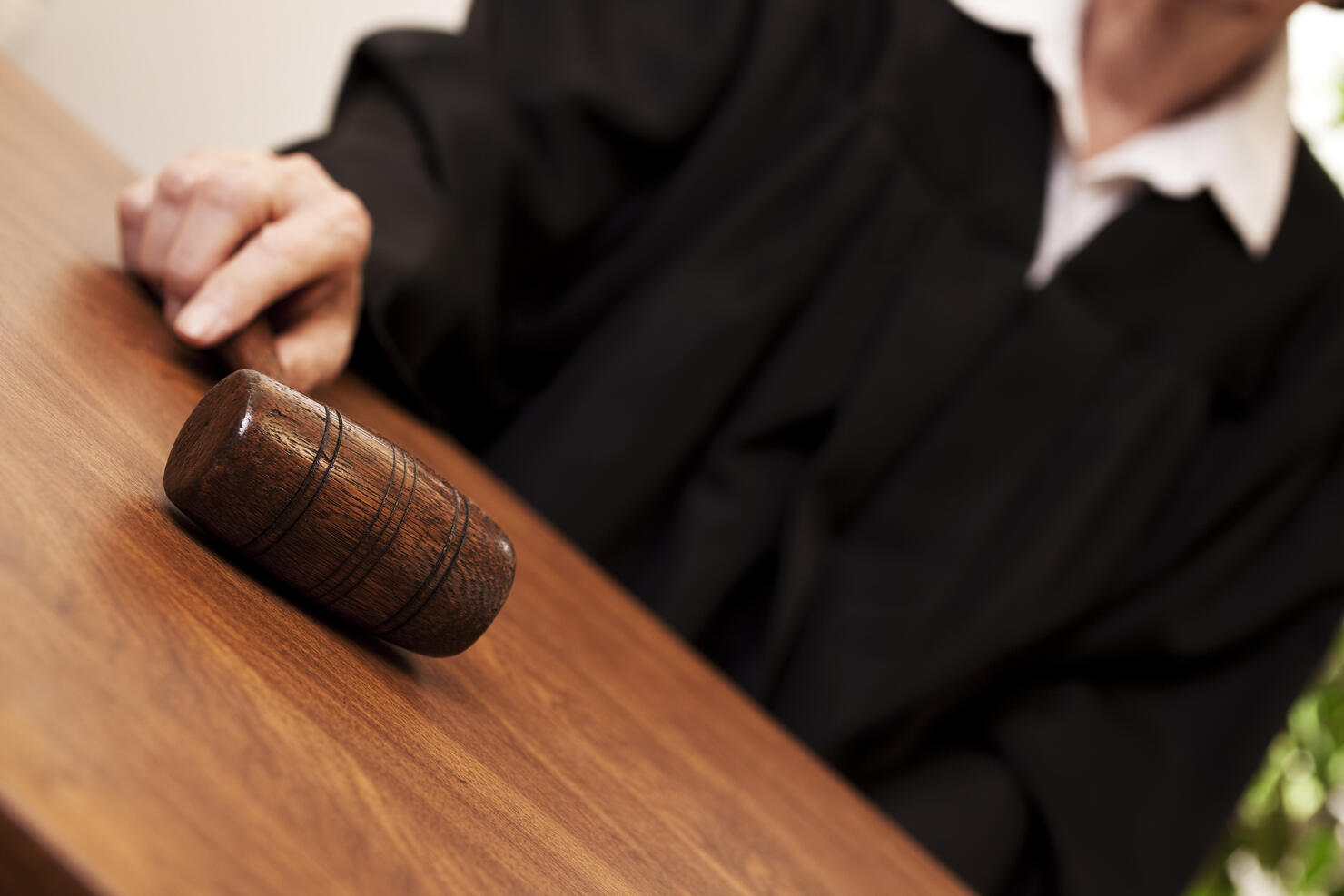 Judge in black robe with gavel