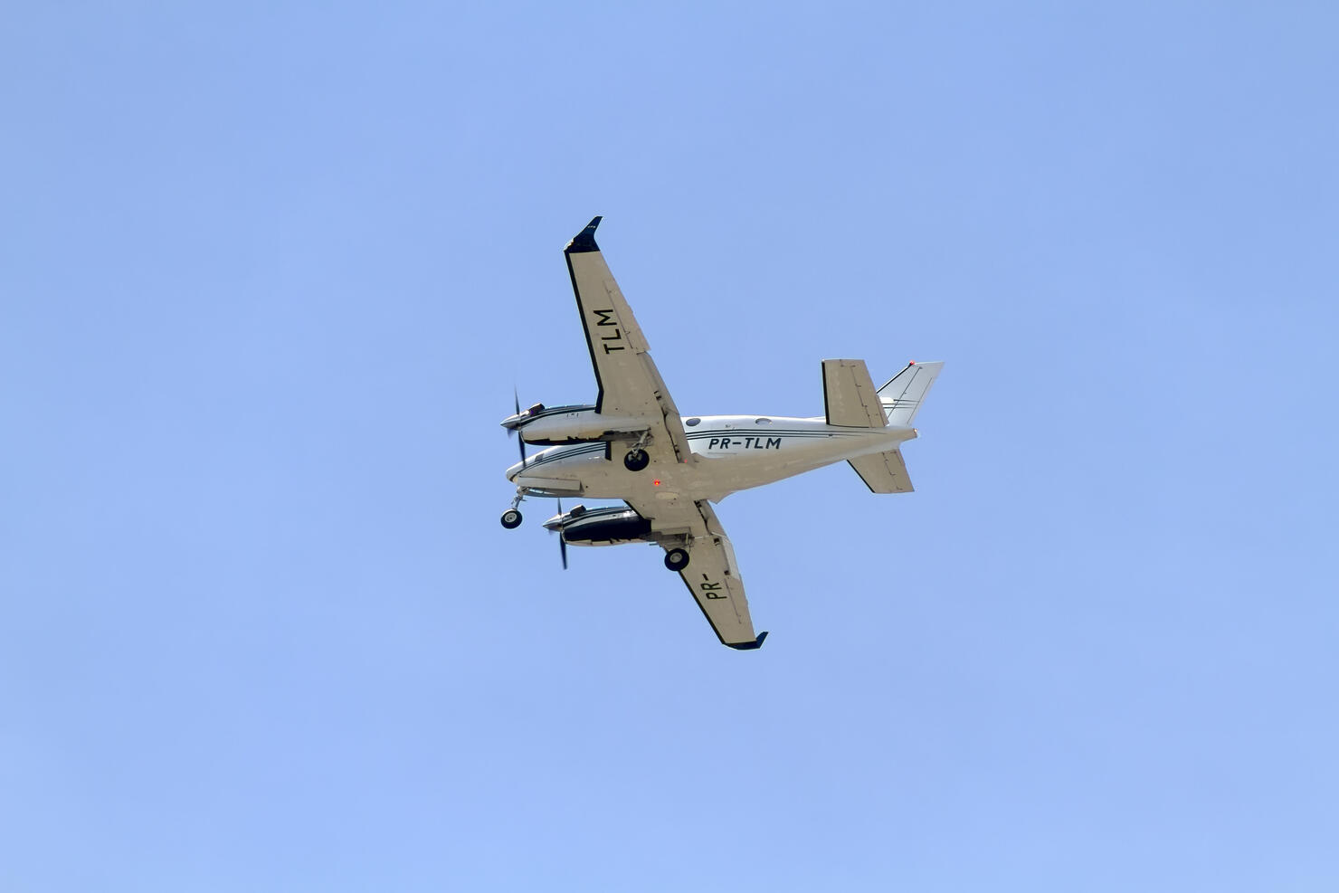 Airplane flying against blue sky
