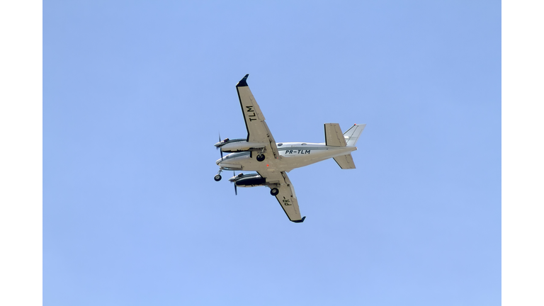 Airplane flying against blue sky