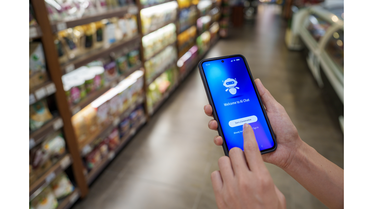 Using AI chatbot on smartphone in grocery store aisle