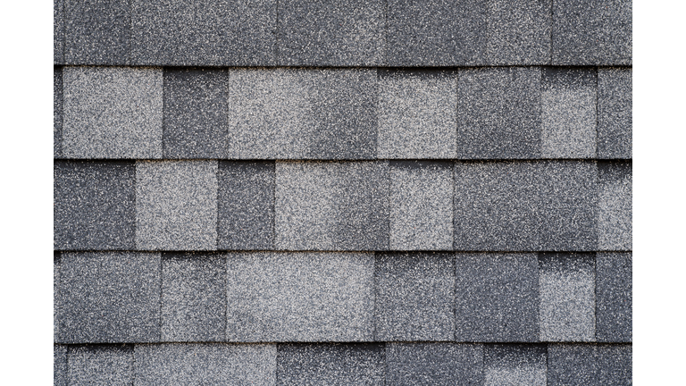 Gray asphalt roofing tiles, overlapped