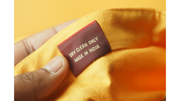 Clothing label showing care instructions and origin details